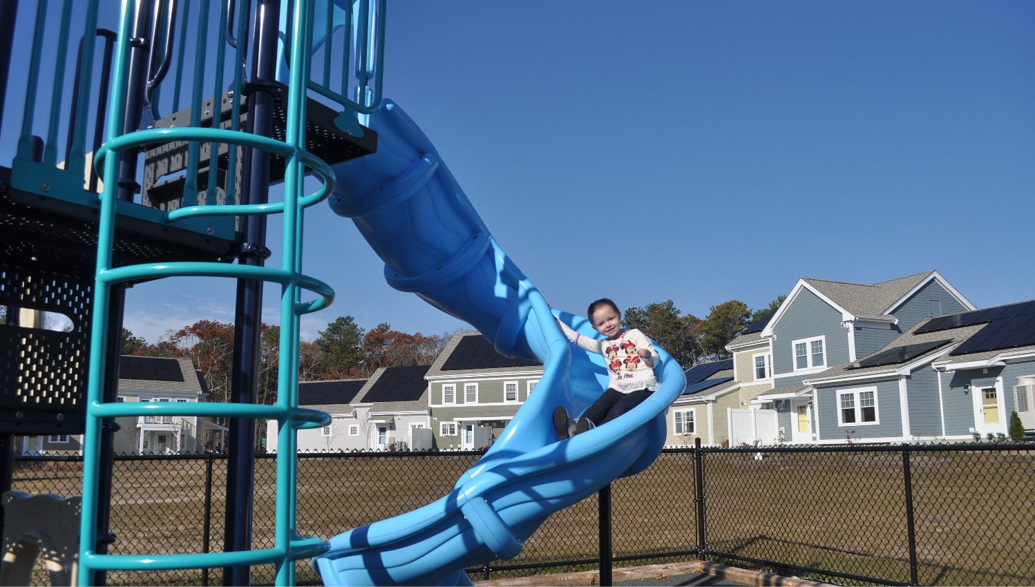 Child on slide in playground