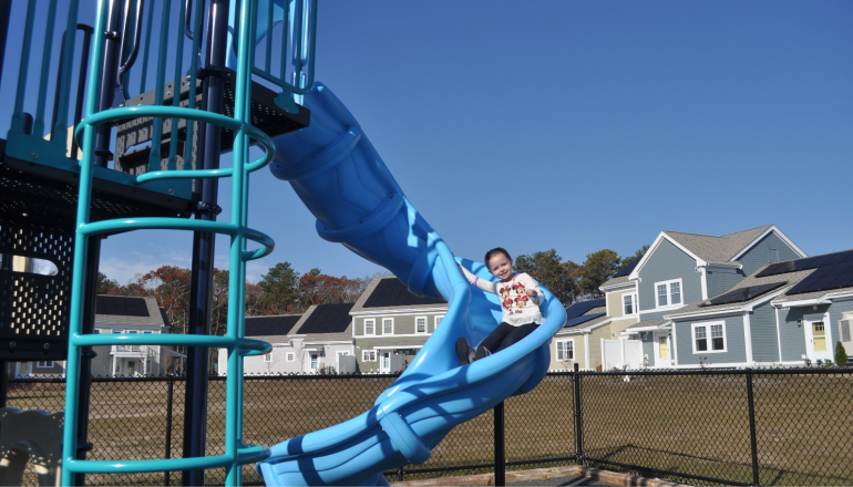 Child on slide in playground