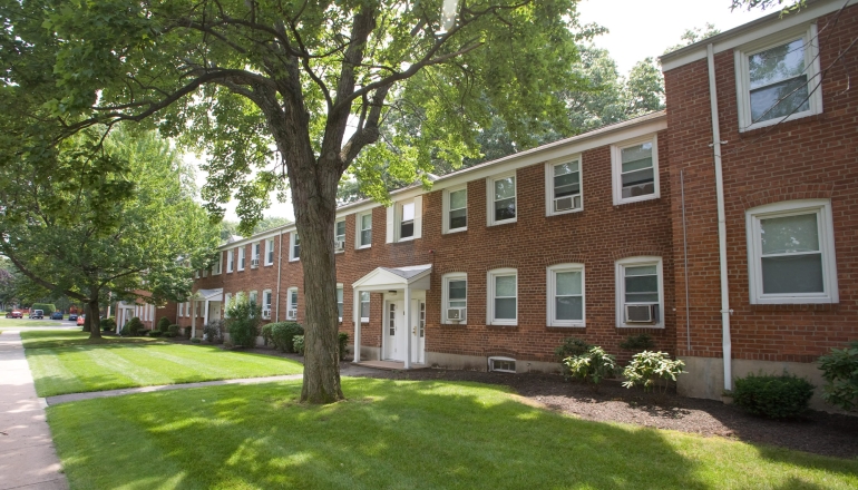 Bay Meadow Apartments exterior with tree