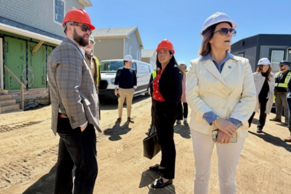 Juana Matias, center, secretary of the Executive Office of Housing and Livable Communities, visited Cape Cod on Tuesday to tour affordable housing sites. With her are state Sen. Julian Cyr, left, and Rep. Hadley Luddy, right.