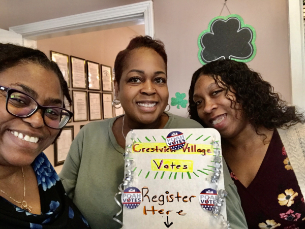 staff with voter registration station