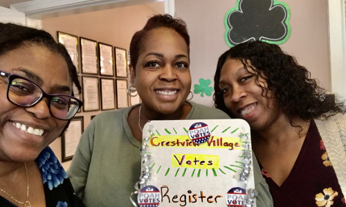 staff with voter registration station