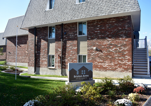 Briston Arms Apartments exterior and sign 